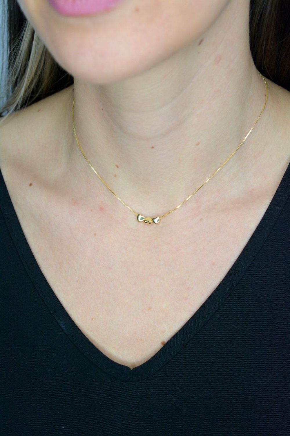 Naszyjnik damski srebrny pozłacany z trzema serduszkami Armonica Nomination 241305 006.png